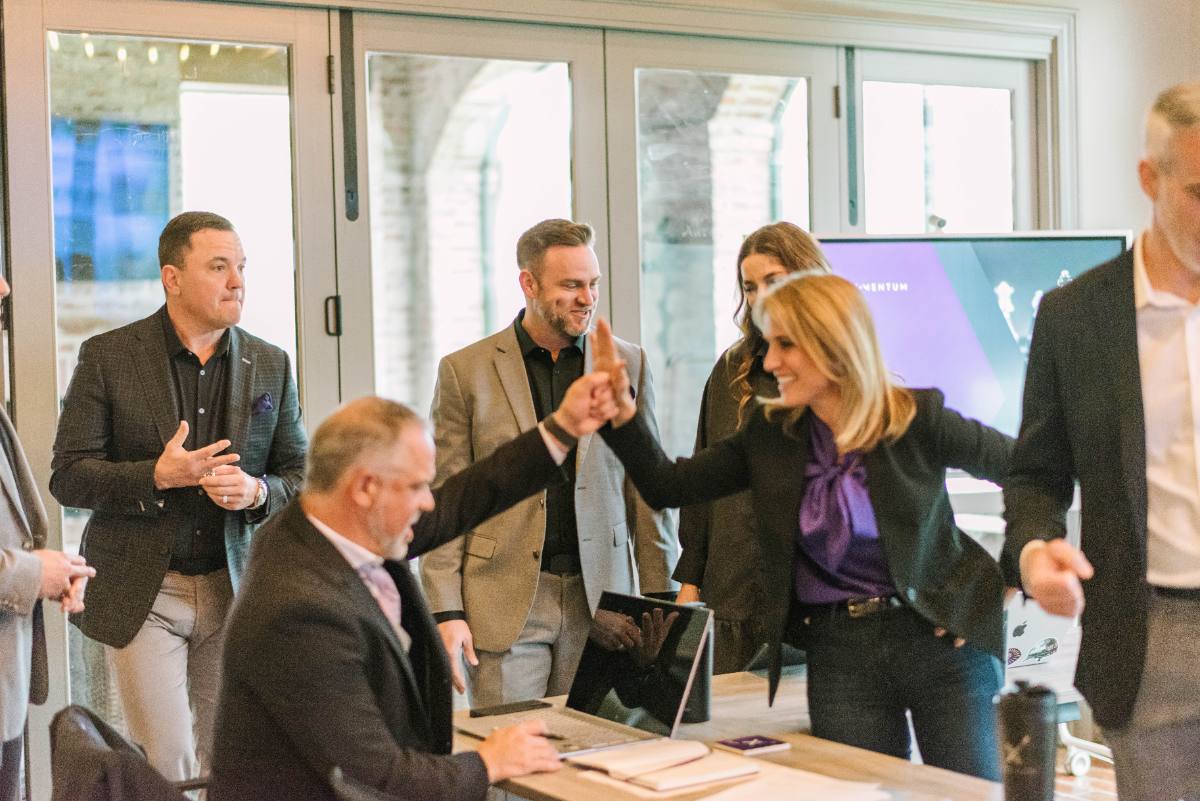 The EXM team celebrating a client win